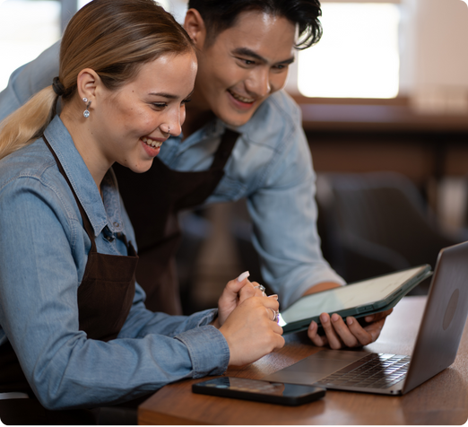 Man and woman workers on laptop and tablet. 