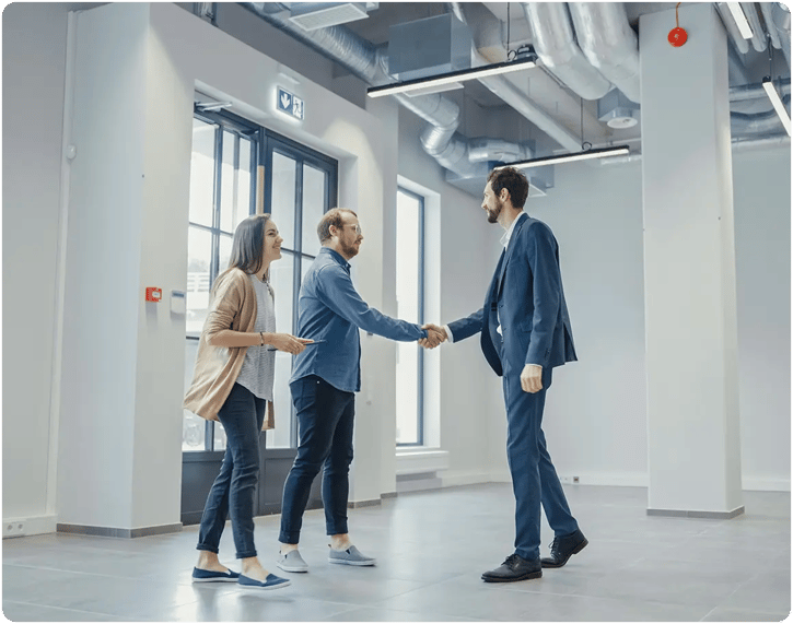 Real estate agent meeting two individuals. 