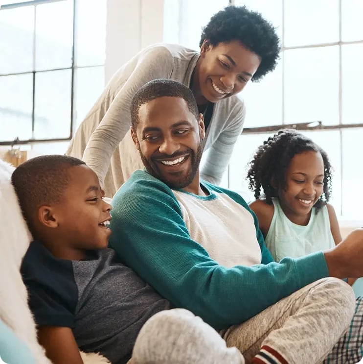 Family hanging out with their two young kids. Family hanging out with their two young kids.