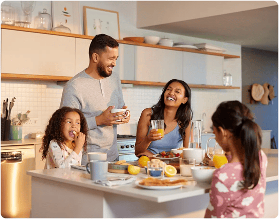 Family eating together at dining table.