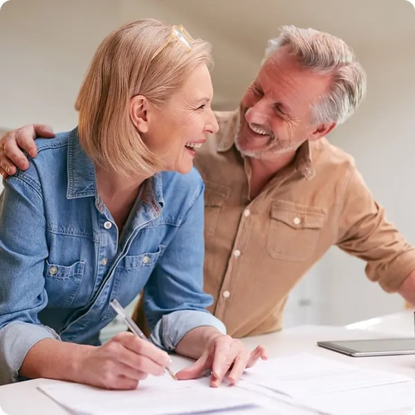 Man smiling at woman. 